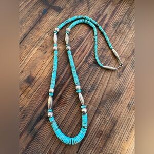 Vintage Native Turquoise heishi and sterling bench bead necklace. 24 inches